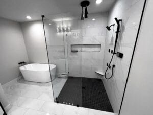 Luxury walk-in shower with professional tile installation in a modern bathroom remodel.