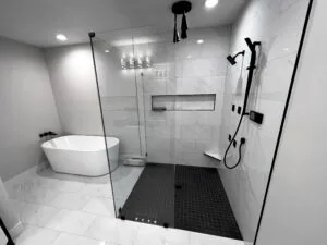 Luxury walk-in shower with professional tile installation in a modern bathroom remodel.