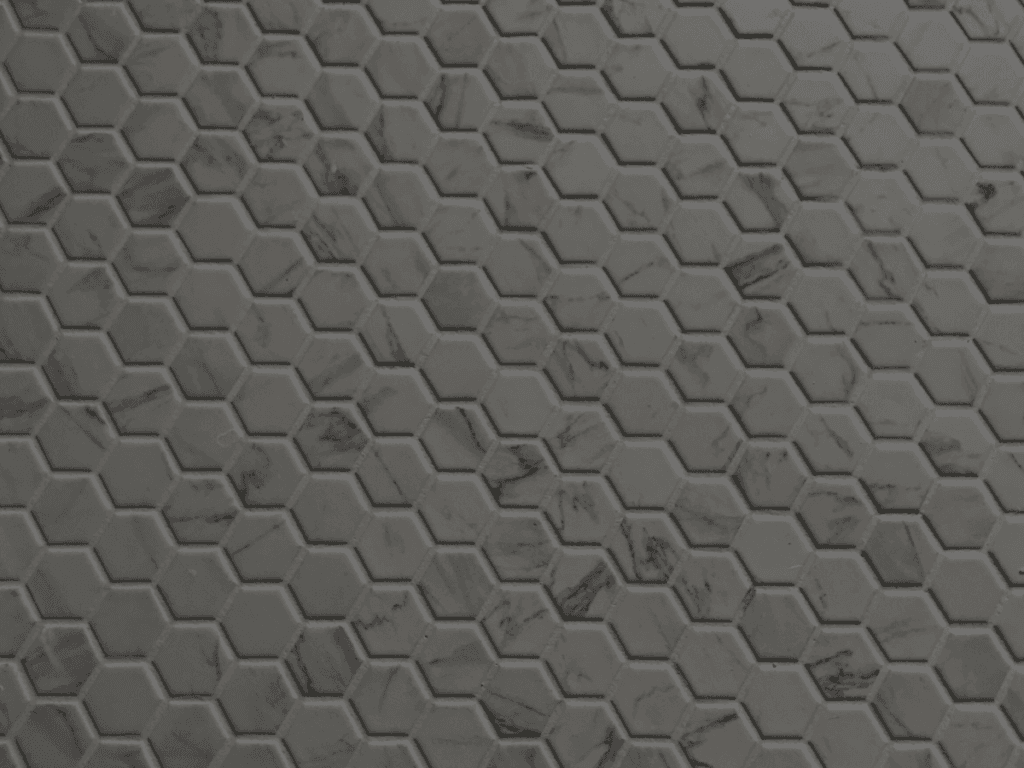 Close-up of marble hexagon tiles with flawless grout lines and perfect spacing.
