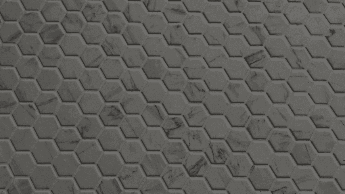 Close-up of marble hexagon tiles with flawless grout lines and perfect spacing.